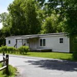 Mobile home on nicely manicured lot in Bennington.